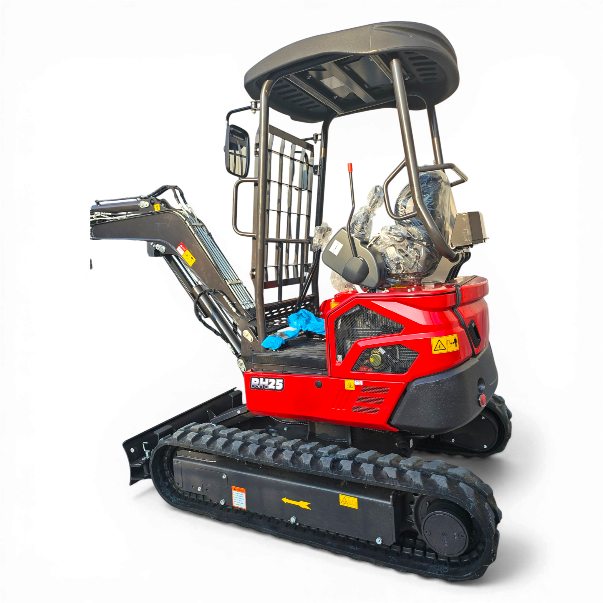 Red tracked construction vehicle with an open operator cabin and seat wrapped in plastic, viewed from the side/front.