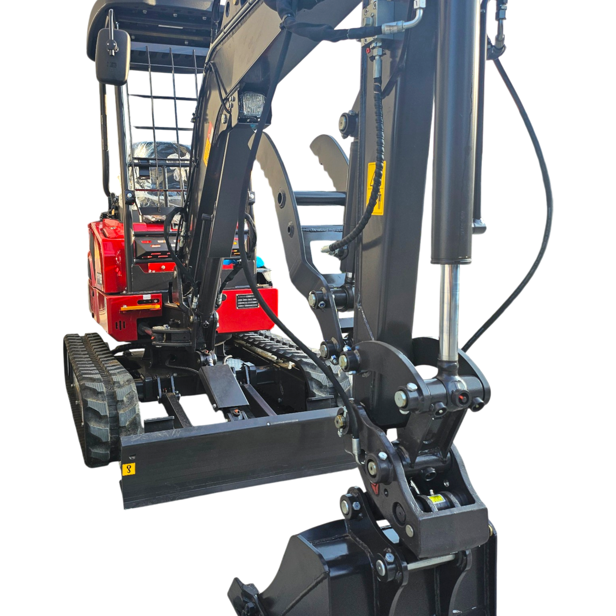 Close-up of a construction excavator's hydraulic arm and chassis, showing tracks and dark metal components.