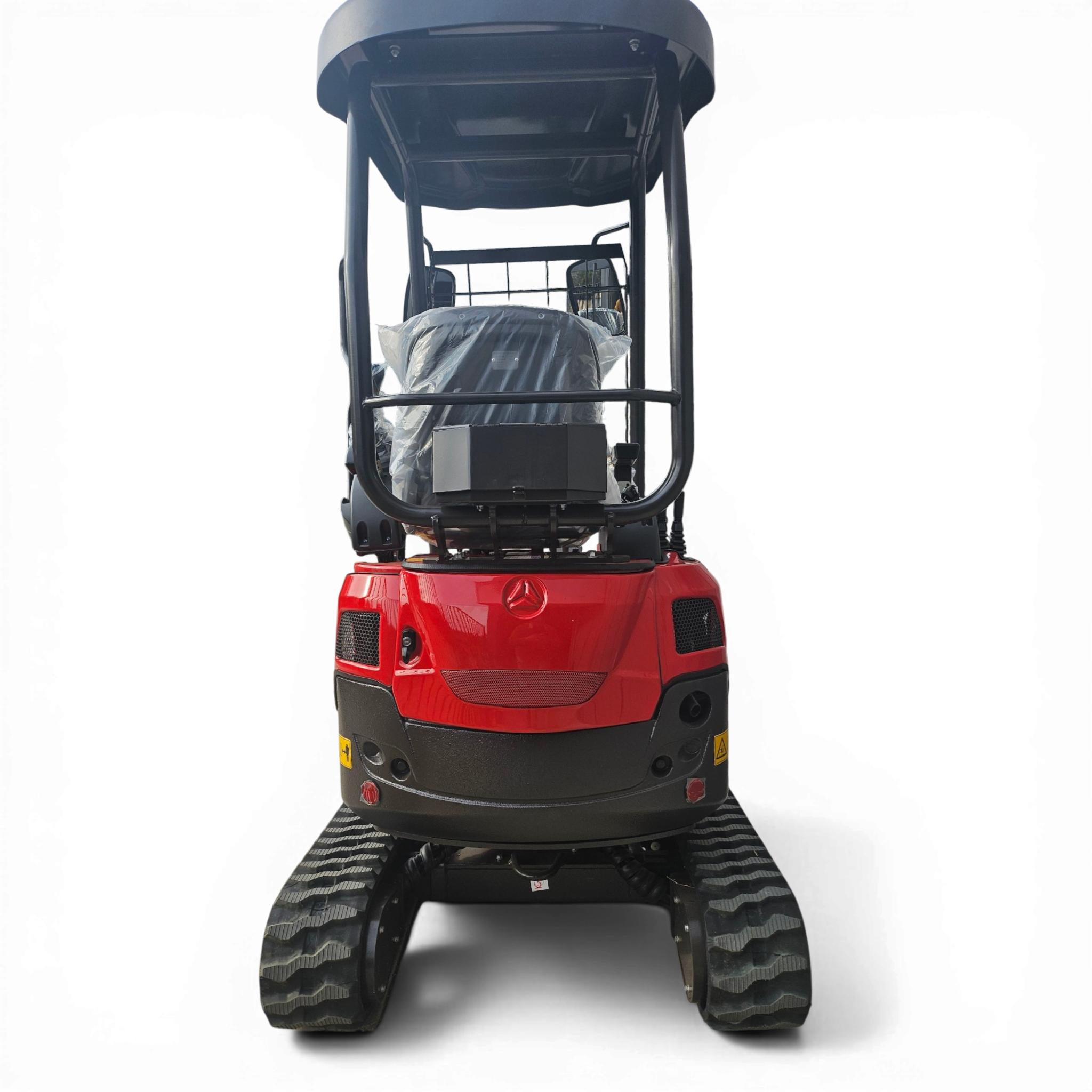 Front view of a red construction vehicle with large black tracks and exposed cabin components against a black background.”