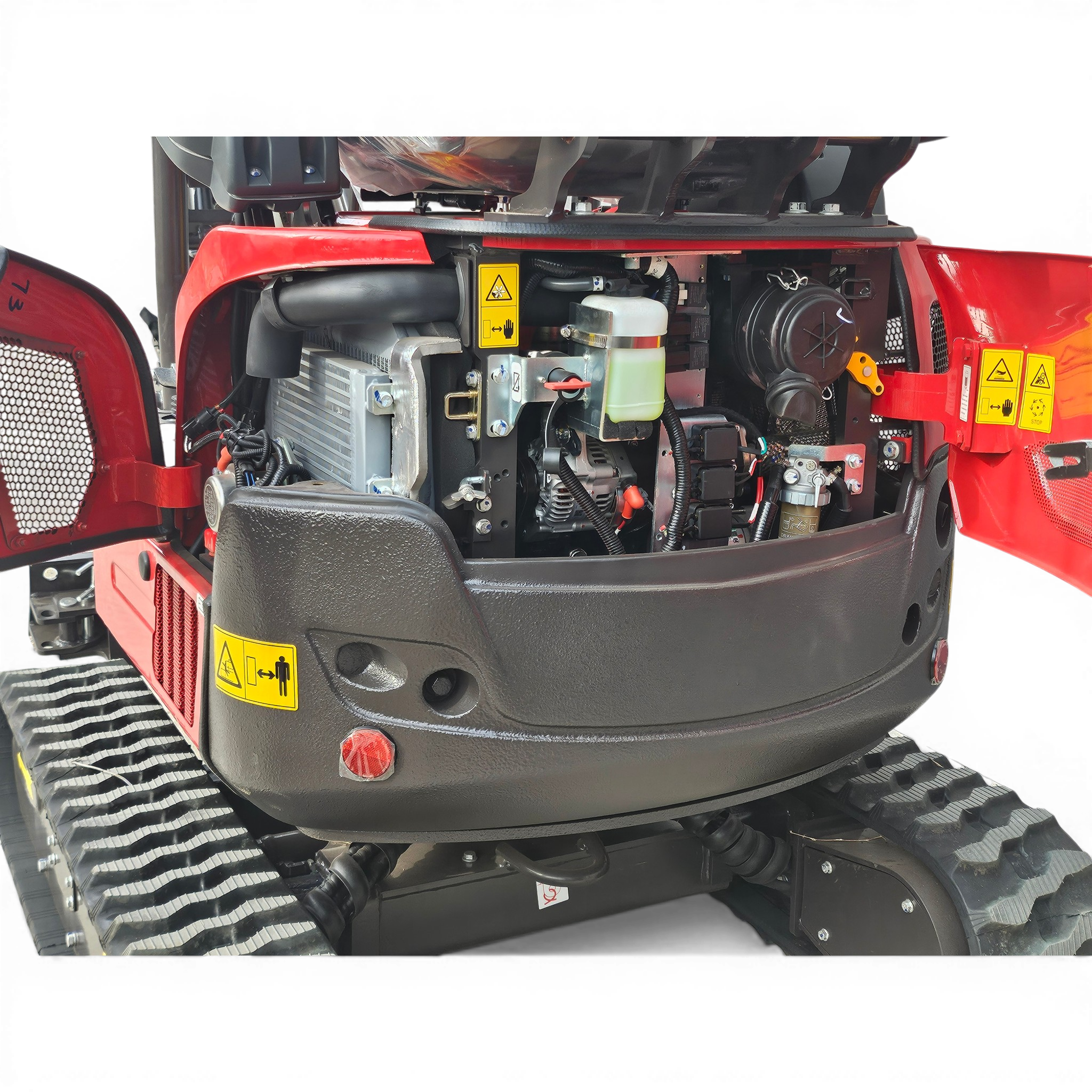 Open engine compartment of a red agricultural tractor showing hydraulic reservoir, wiring, and exposed metal components with warning labels visible in the foreground.