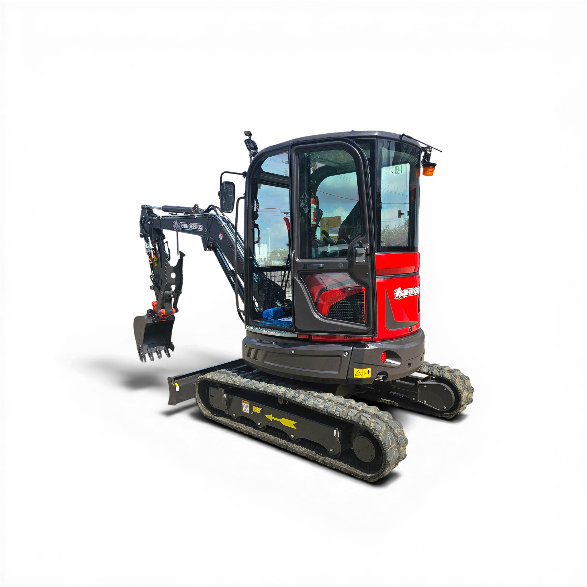 Front-right view of a compact excavator cab with a long hydraulic arm and metal tracks visible, set against a black background.