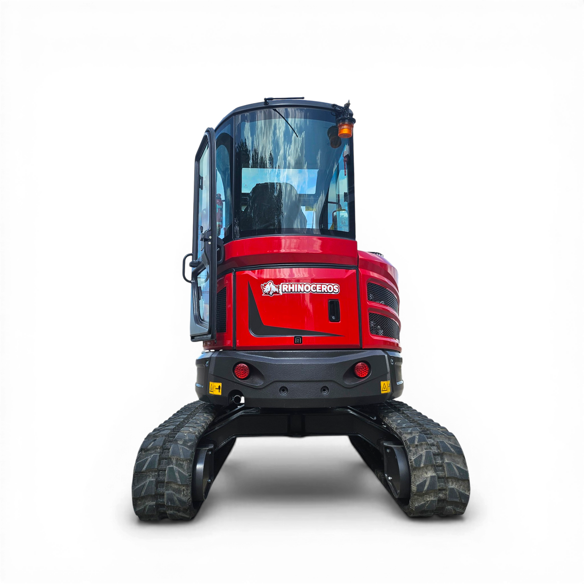 Front of a red heavy equipment vehicle with large rugged tires and a Rhino logo on the grille