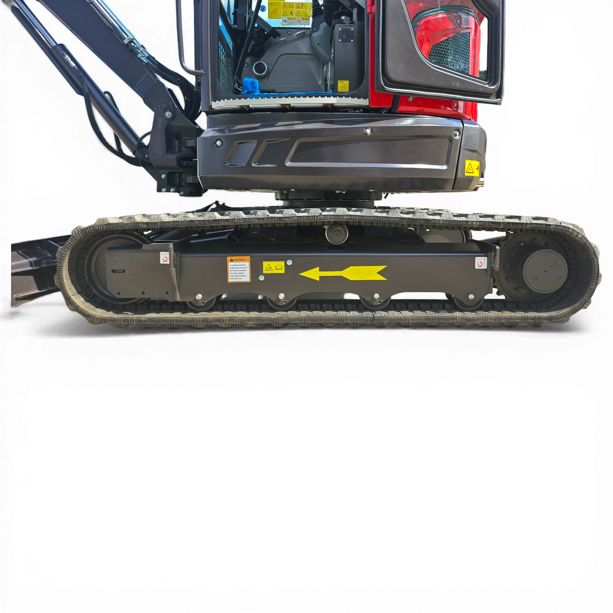 Close-up of a red excavator cab with a hydraulic arm and tracked undercarriage; safety labels are visible on the body.