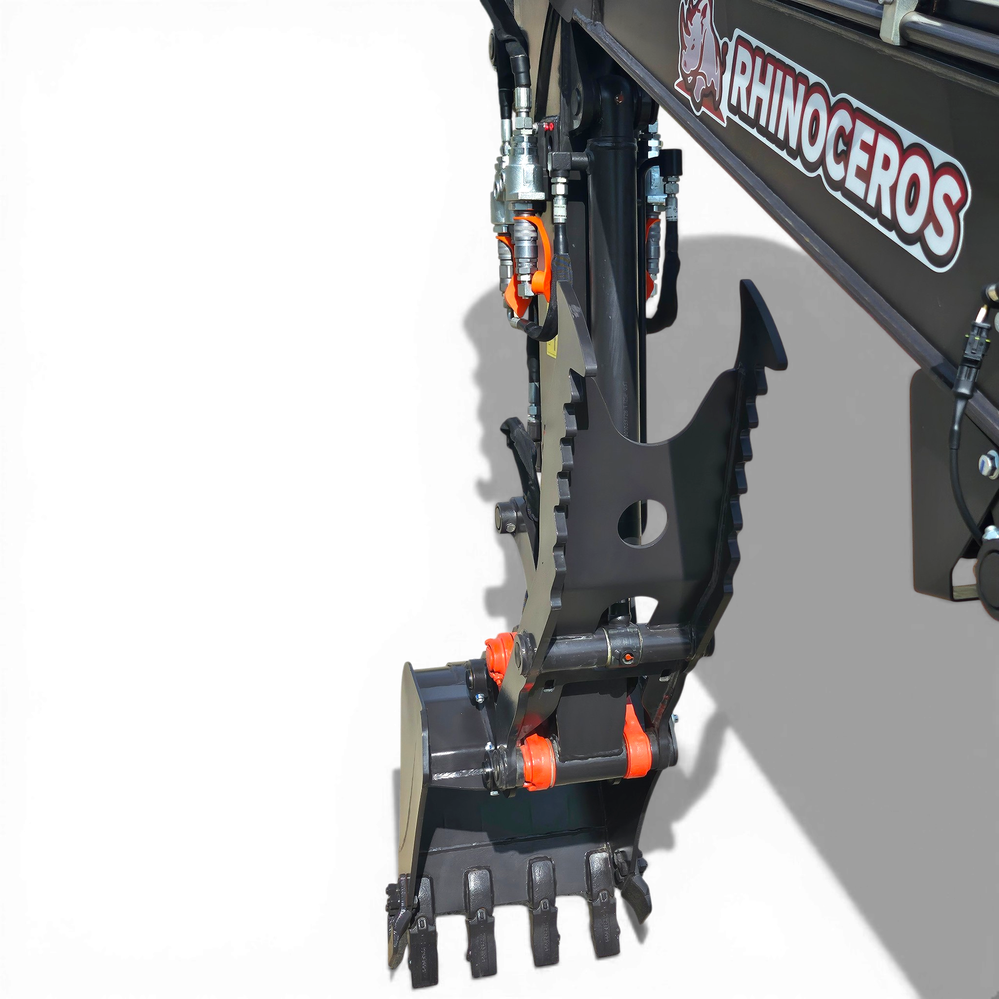 Close-up of a hydraulic actuator and metal linkage on a dark industrial machine, with orange pins and a RHINOCEROS logo visible on the side.