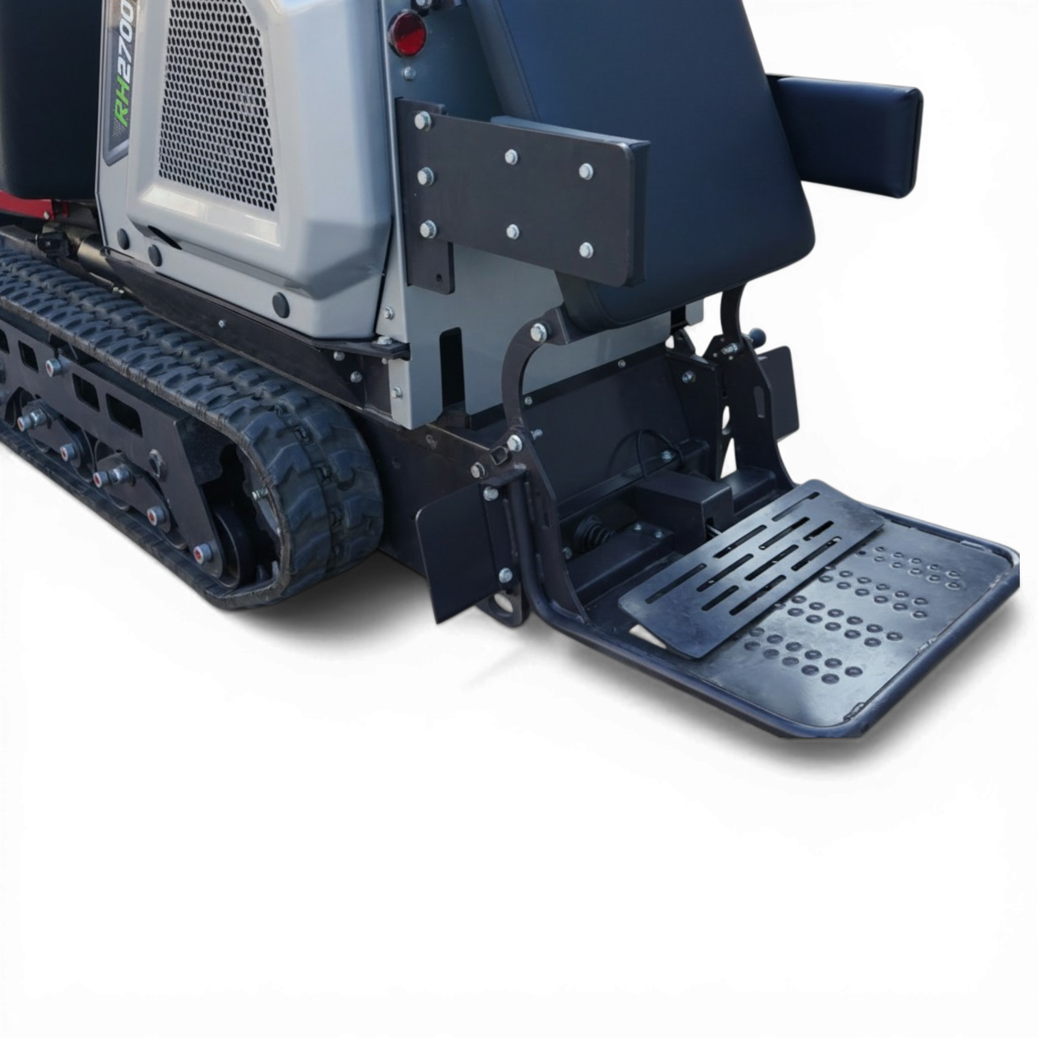 Close-up of a tracked industrial machine: metal frame, bolted bracket, and perforated side panel with a footstep platform nearby.