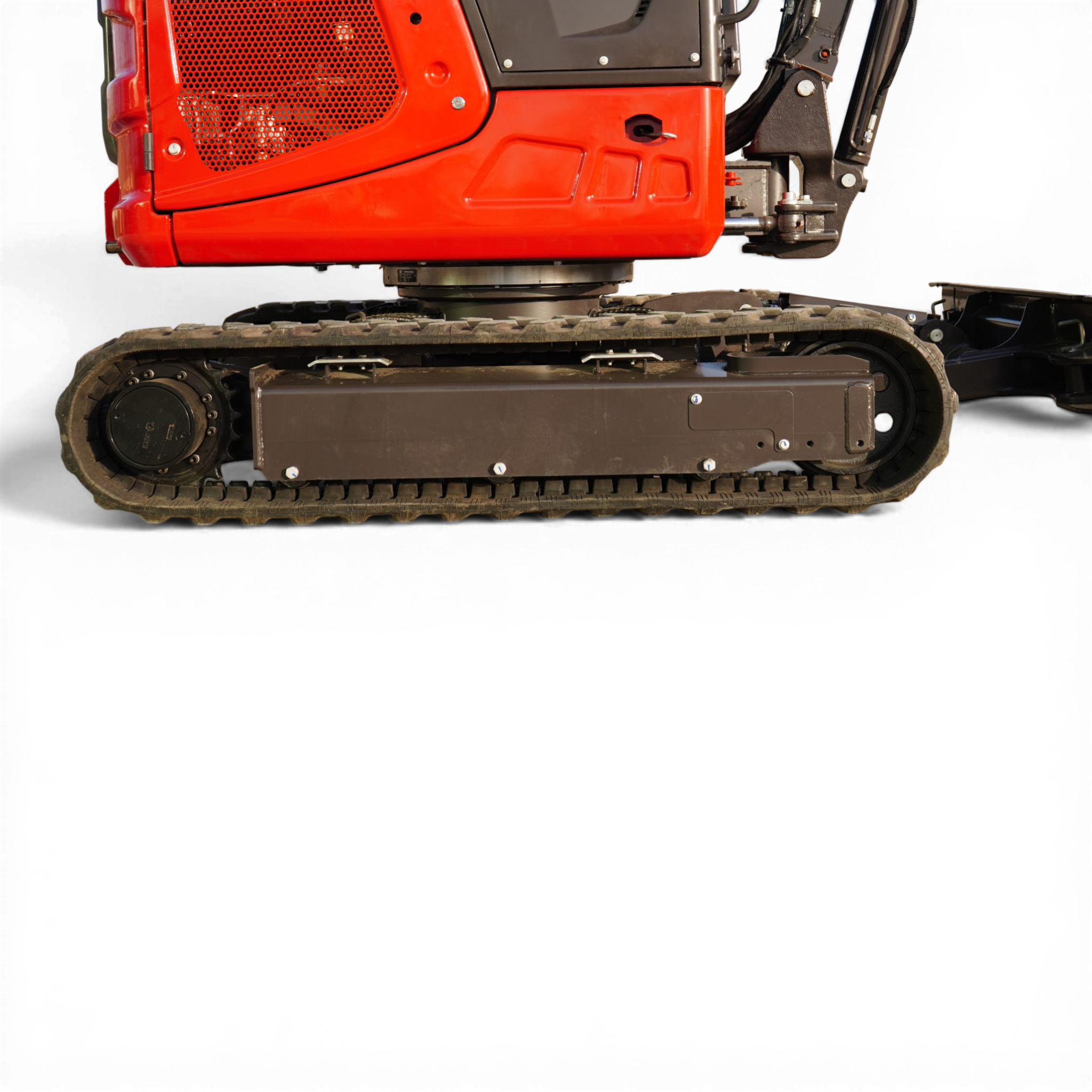 Red excavator body with metal guarding and black tracks visible, emphasizing machinery ready for operation