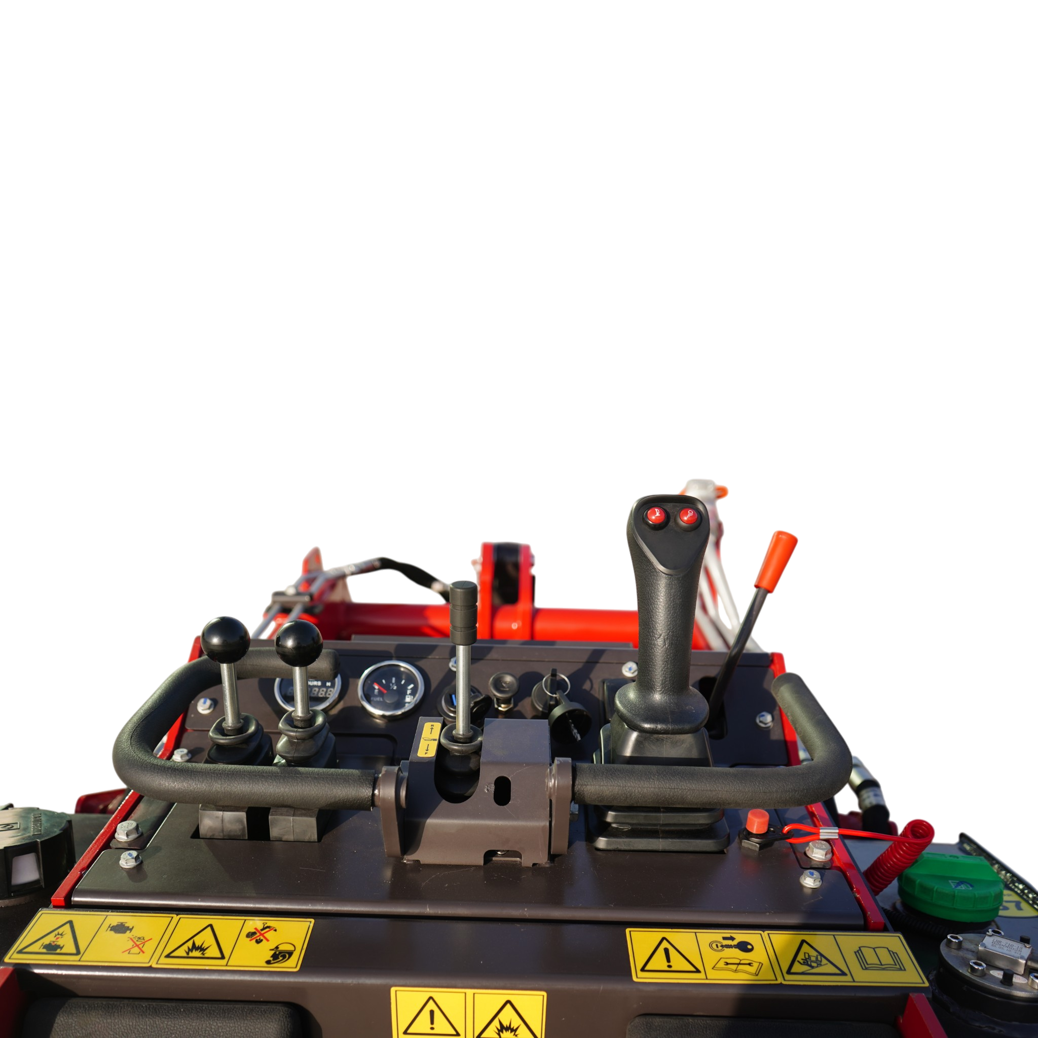 Close-up of a red industrial vehicle cockpit with multiple levers and warning labels on the dashboard.