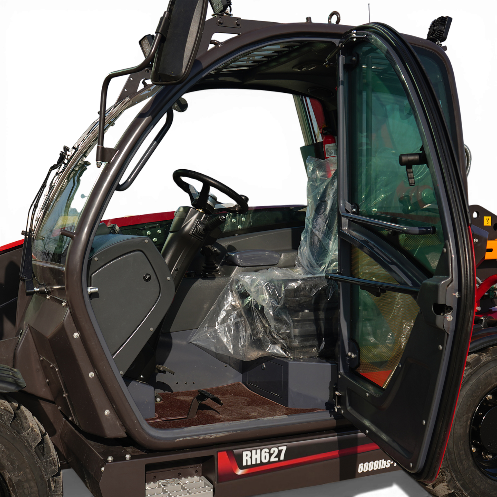 Close-up of a heavy machinery cab with door open, showing steering wheel, plastic-covered seat, steps, and the RH627 plate on the side panel