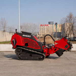Red tracked roadheader-style machine with a large rotating cutting head at the front, labeled RHG30, sitting on a concrete lot with a cityscape in the background