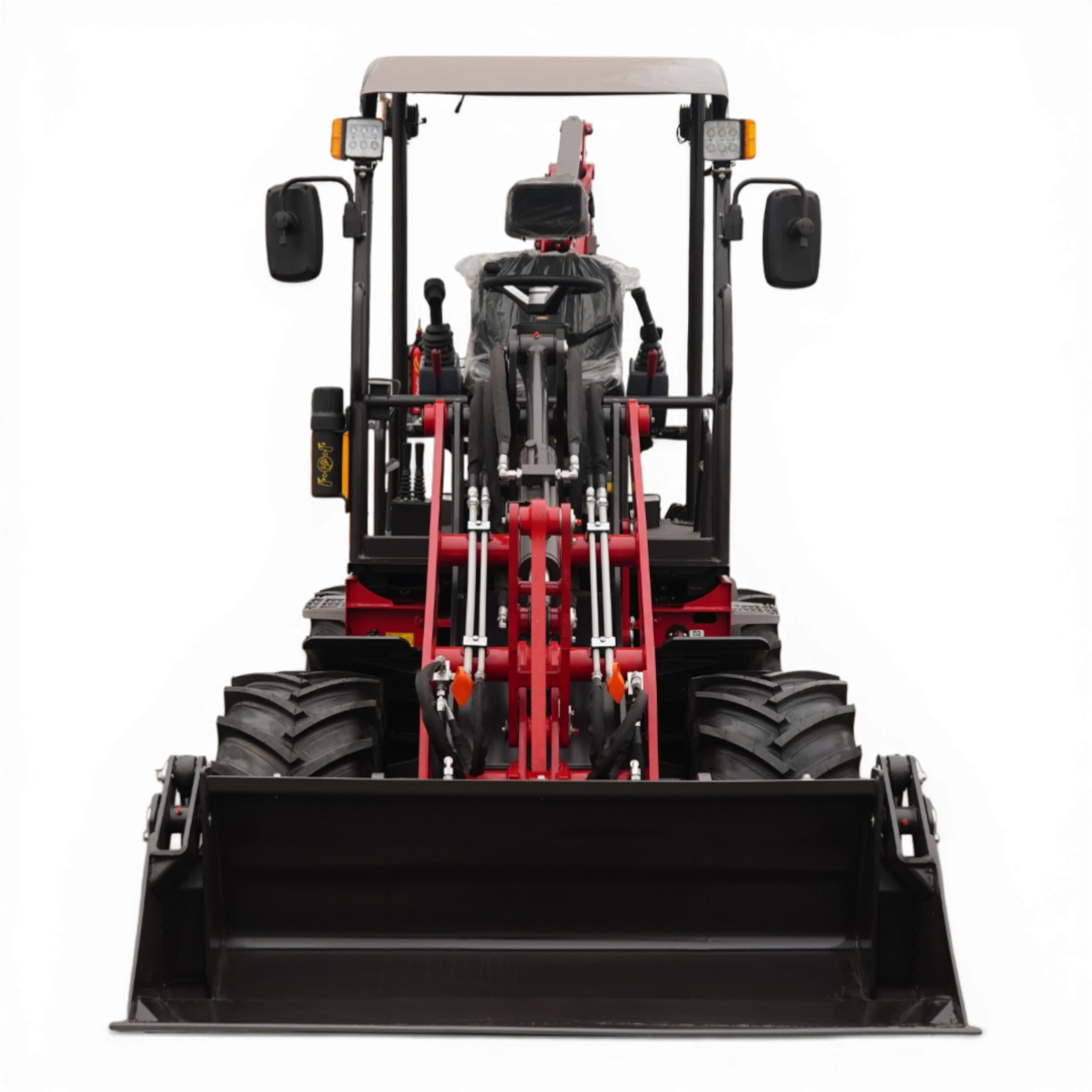 Front view of a large red and black front-loader vehicle with oversized tires and hydraulic arms, facing the camera