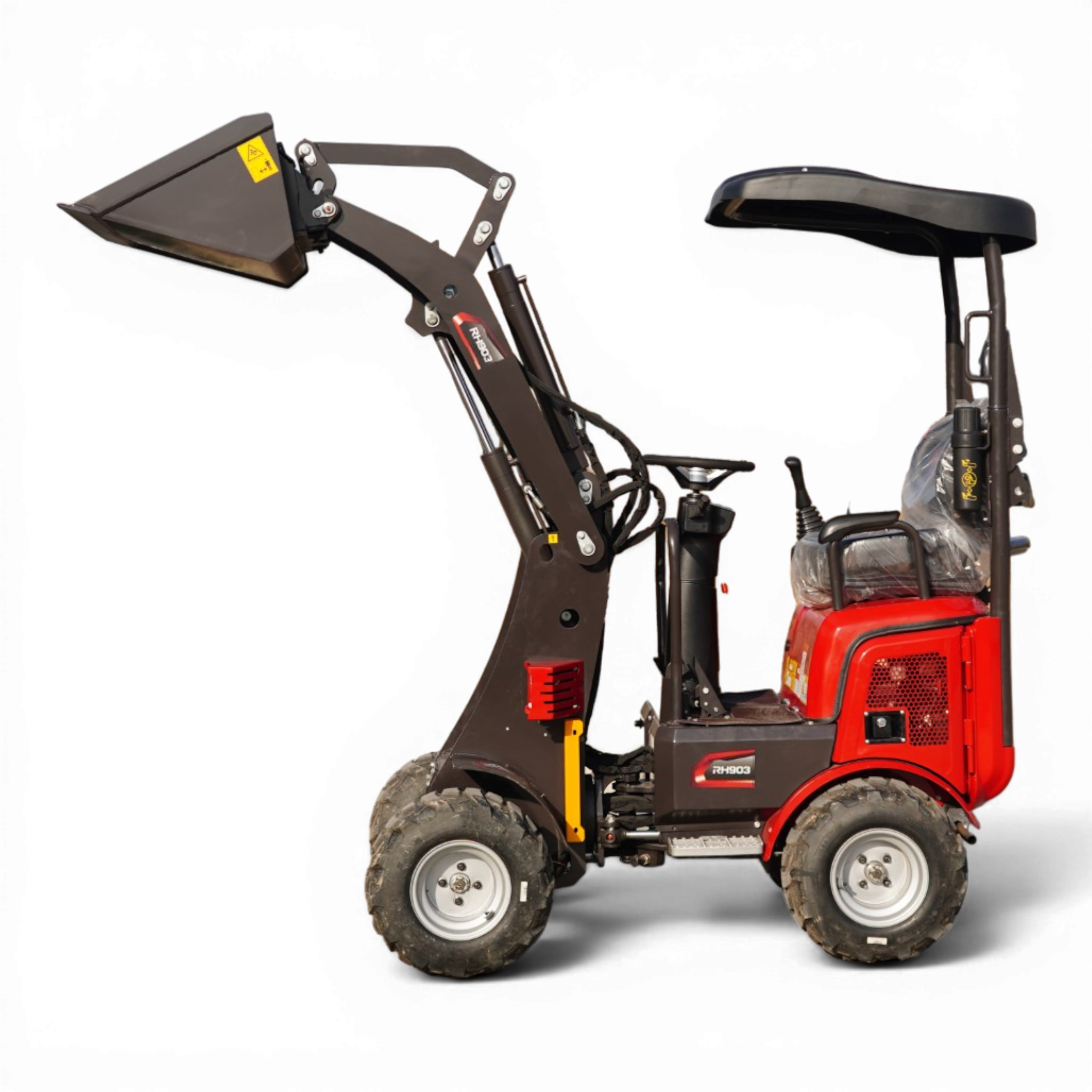 Red construction vehicle with hydraulic arm and bucket raised against a black background